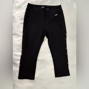 Large black leggings with fun design on leg. Like new. Excellent quality.